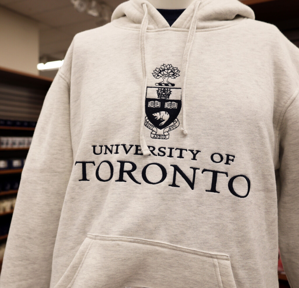 Display of heather grey U of T hoody centre signature